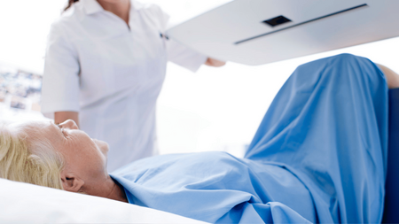 female patient in bone density machine